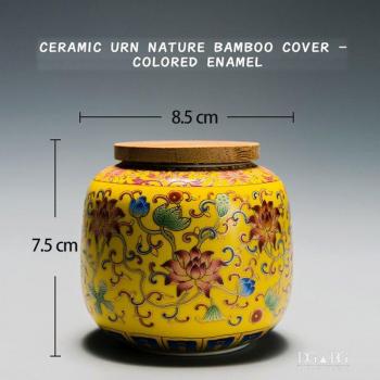 Urna para cenizas de mascotas en cerámica esmaltada con flor azul y blanca